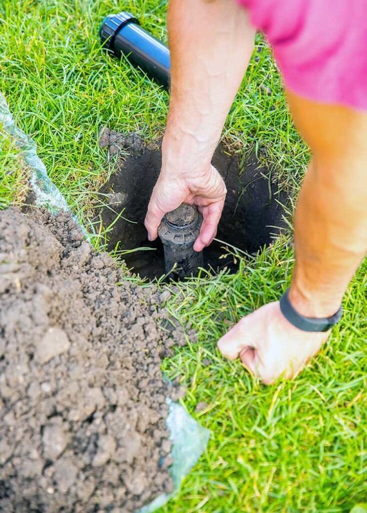 IRRIGATION SERVICES - southeast-landscape-Installing-sprinkler
